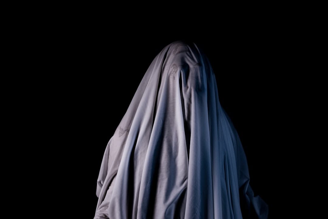 A ghostly figure in the dark with a black background
