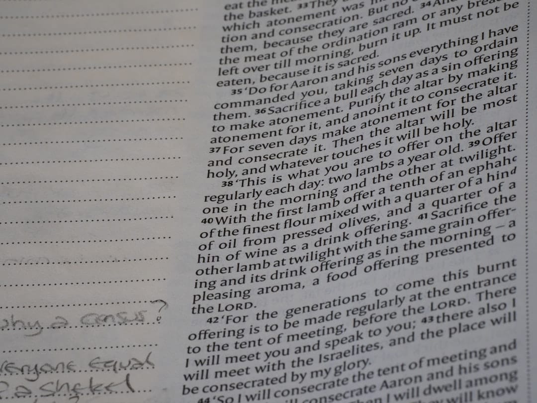 Close-up of text in a book with handwritten notes.