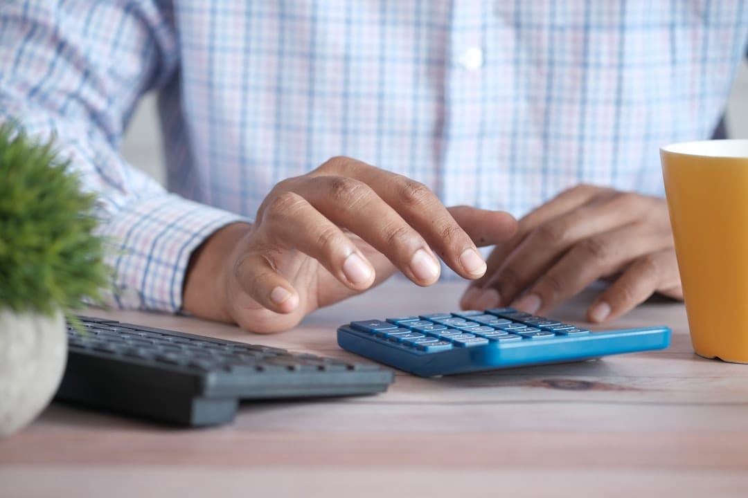 Person using black computer keyboard