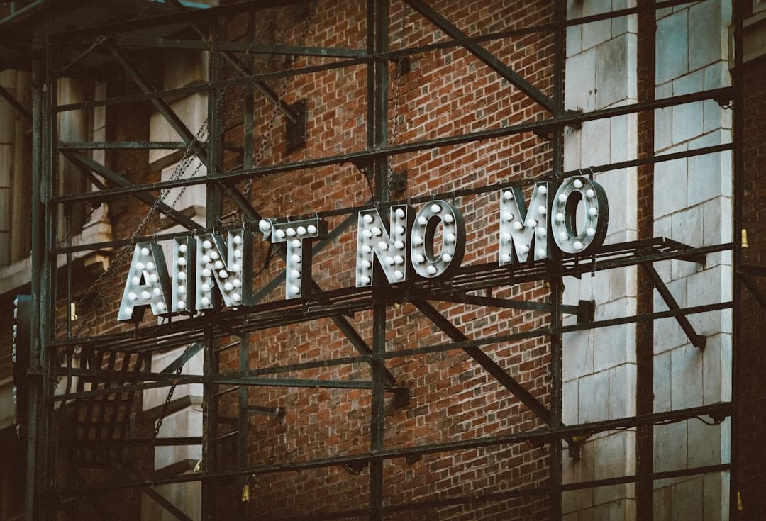 A brick wall with a sign on it