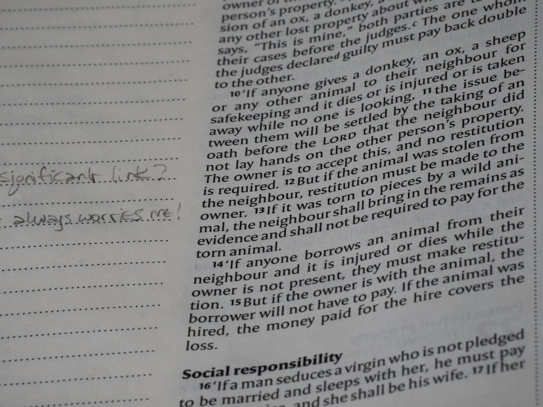 Close-up of a page from a book with handwritten notes.